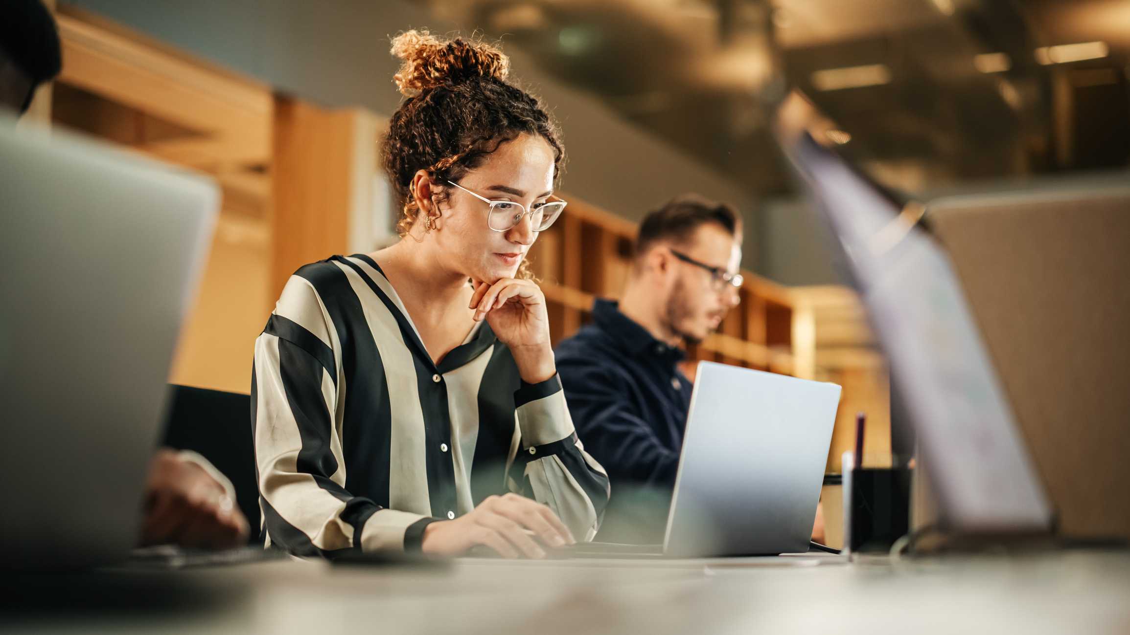Women working on business loan application on her computer.